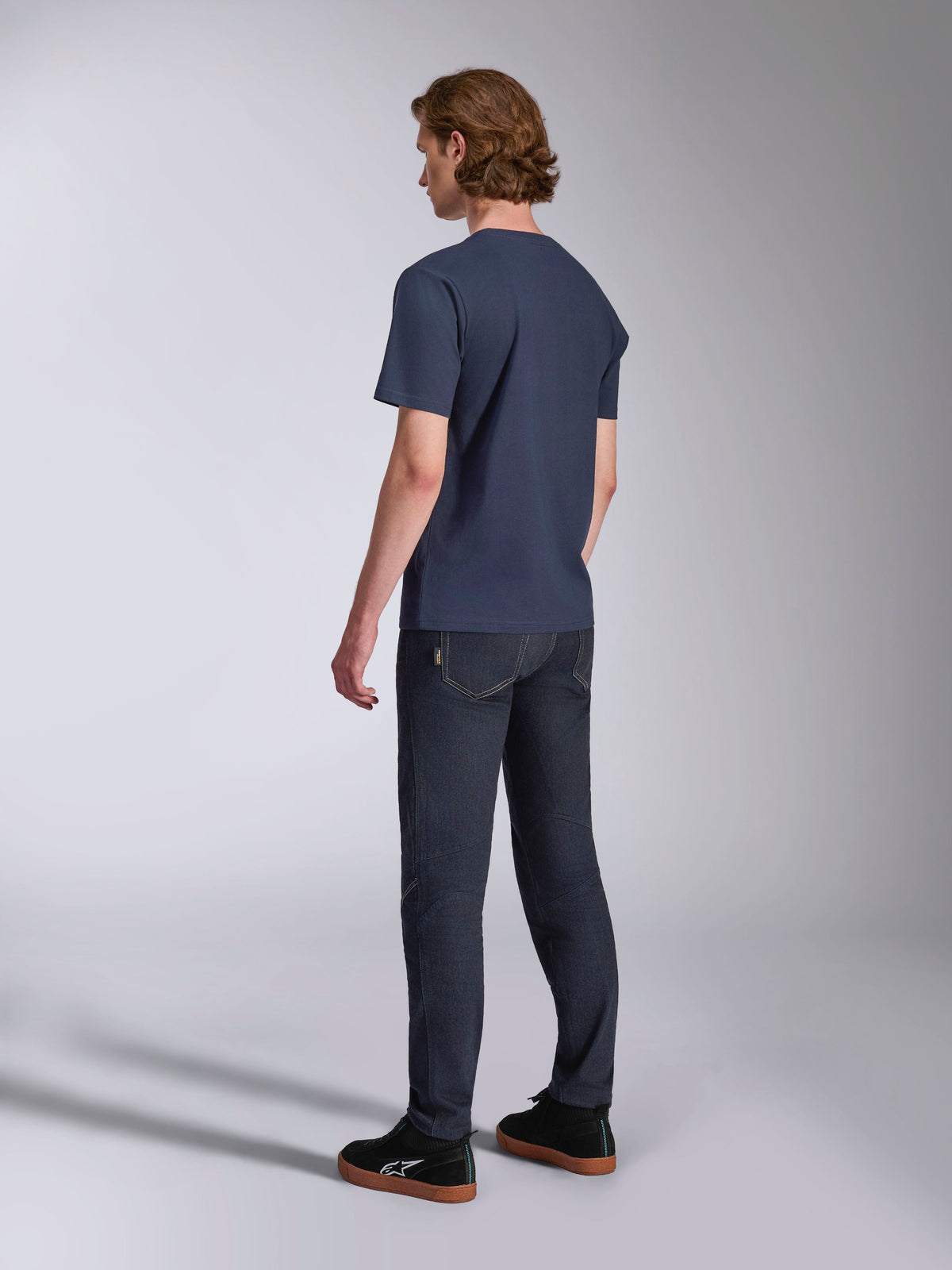Alpinestars Ageless 2.0 CSF Tee, Short Sleeve T-Shirt, Navy, back view, worn with dark denim jeans and black sneakers, casual motorsport streetwear