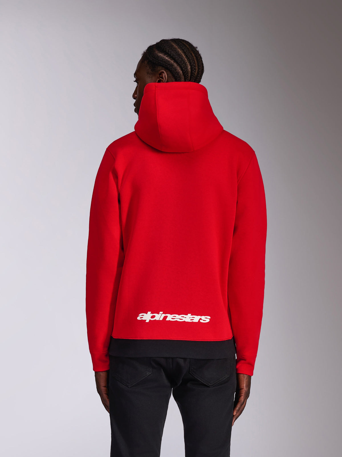 Alpinestars Parallel Hoodie, Rückansicht, Rot mit schwarzem Rippsaum, weißes Alpinestars-Wortlogo auf dem unteren Rücken, lässige, vom Motorsport inspirierte Streetwear