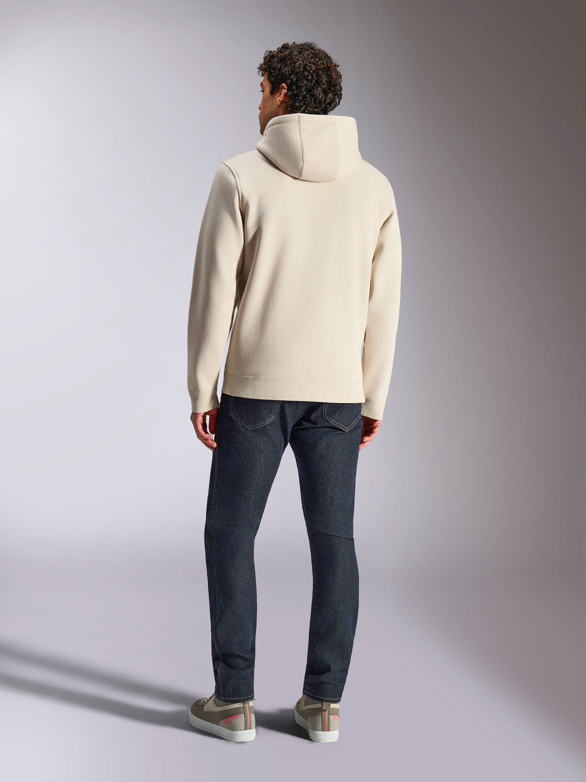Alpinestars Pulse Hoodie, Off White, back view of a man wearing a casual pullover fleece hoodie with dark jeans and sneakers, modern sportswear design