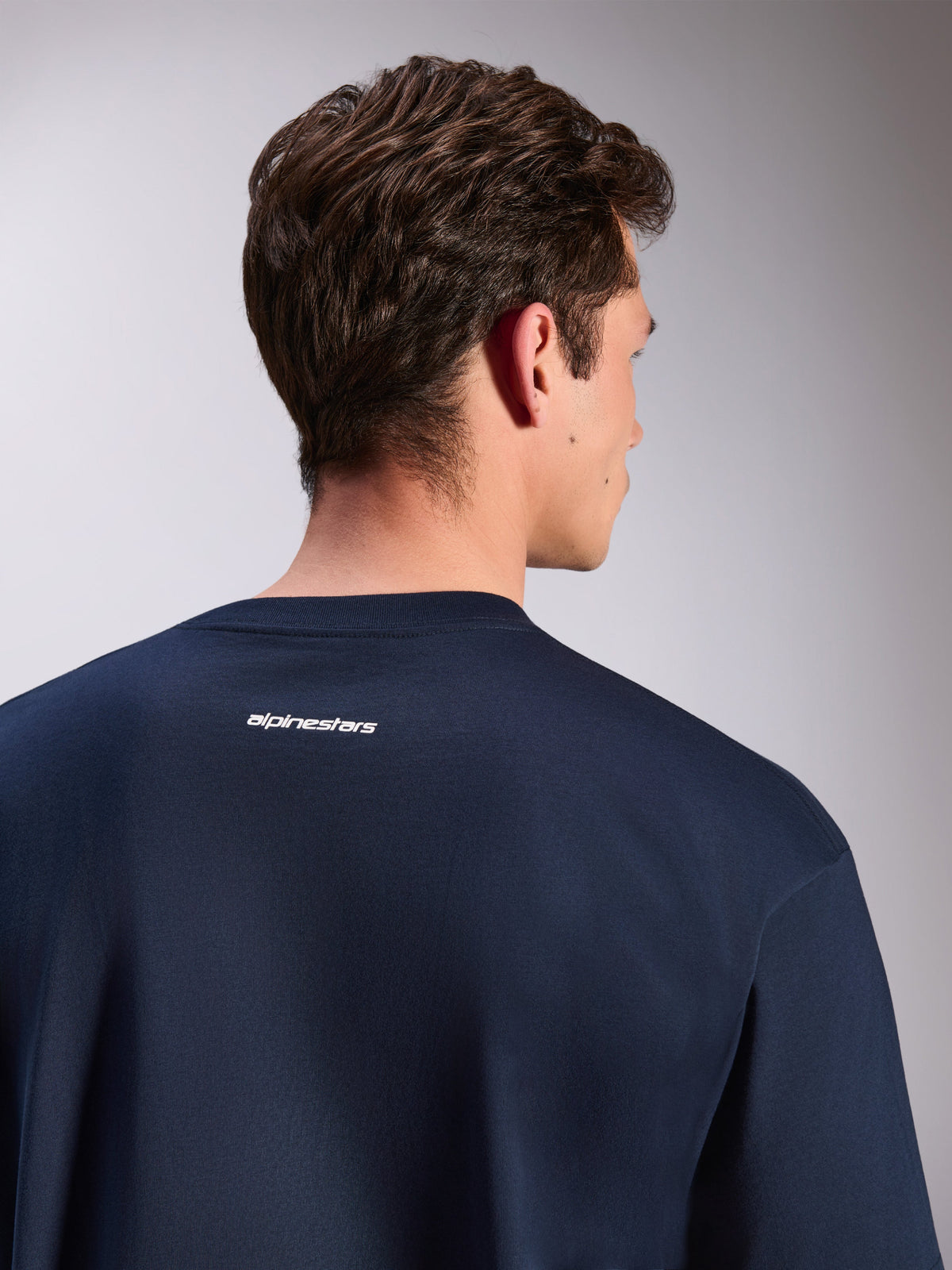 Alpinestars Focused Oversized CSF Tee, Short Sleeve T-Shirt, Navy Blue, featuring a small white Alpinestars word logo on the upper back, oversized fit, casual motorsport streetwear