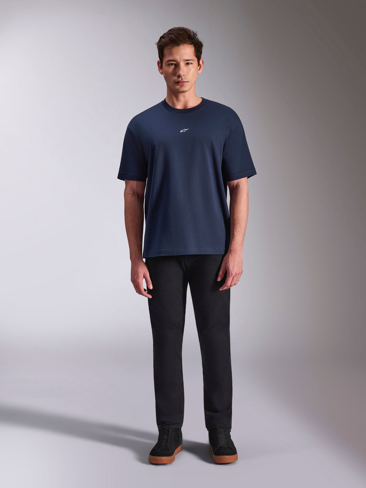 Alpinestars Focused Oversized CSF Tee, Short Sleeve T-Shirt, Navy Blue, small white Astars logo on chest, oversized fit, paired with black pants and black sneakers, casual motorsport streetwear
