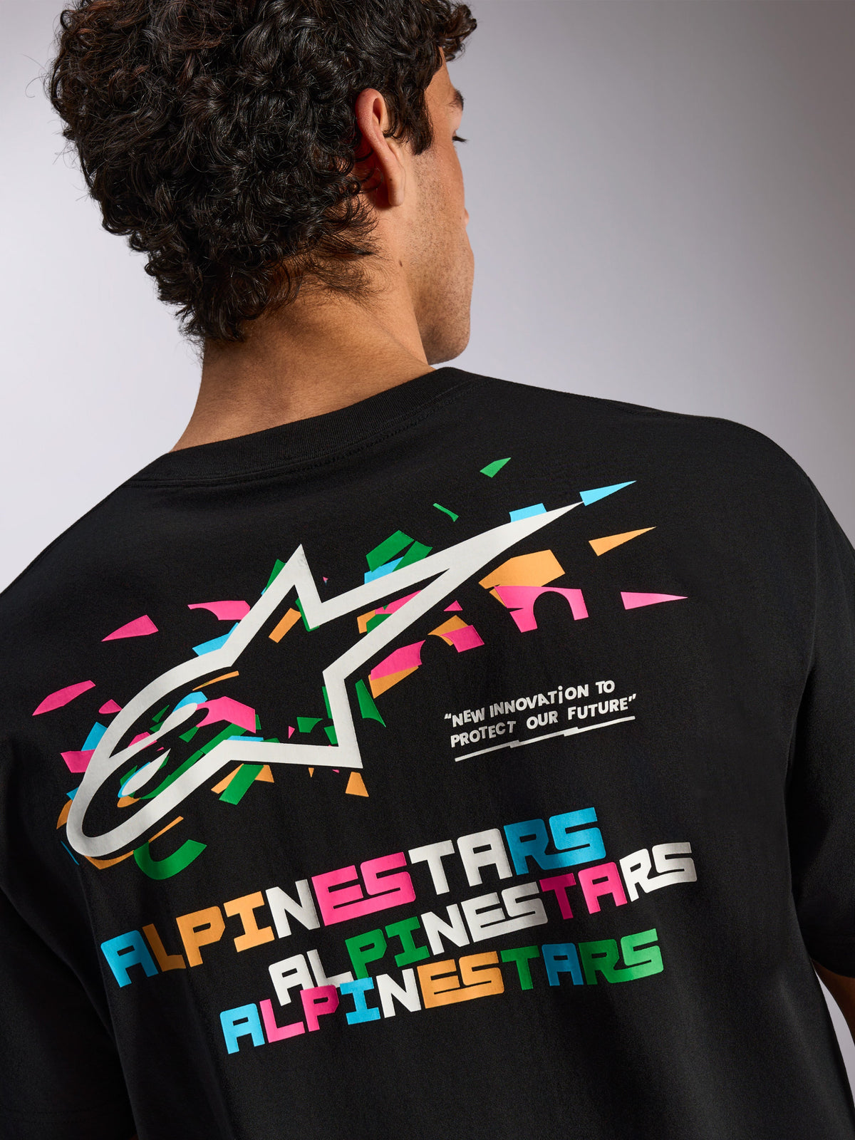 Alpinestars Wild Oversized CSF Tee, Short Sleeve T-Shirt, Black, Large back graphic with vibrant multi-colored Astars logo and typography, Casual Sportswear