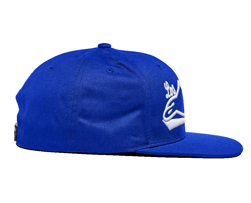 Alpinestars Los Angeles Hat, Blue snapback cap, side profile view, featuring a flat bill and structured crown, bright blue cotton twill with white 3D embroidery, casual sportswear.