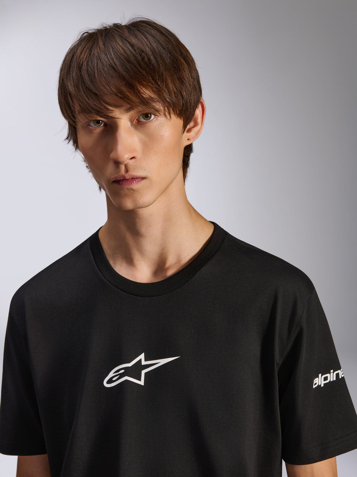 Alpinestars Frontal CSF Tee, Short Sleeve T-Shirt, Black, White Astars Logo on Chest, Worn by Male Model, Casual Performance Sportswear