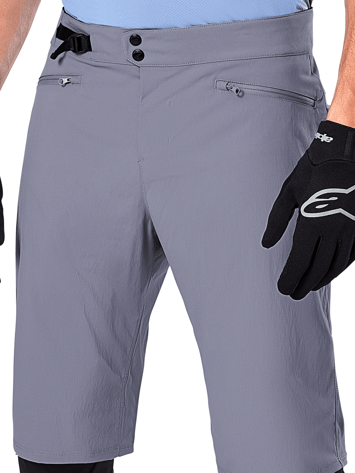 Alpinestars A-Dura Shorts, MTB Shorts, Dark Gray, close-up view of waist showing double snap closure, side cinch adjuster, and zippered pockets, paired with black cycling gloves, durable mountain bike apparel.
