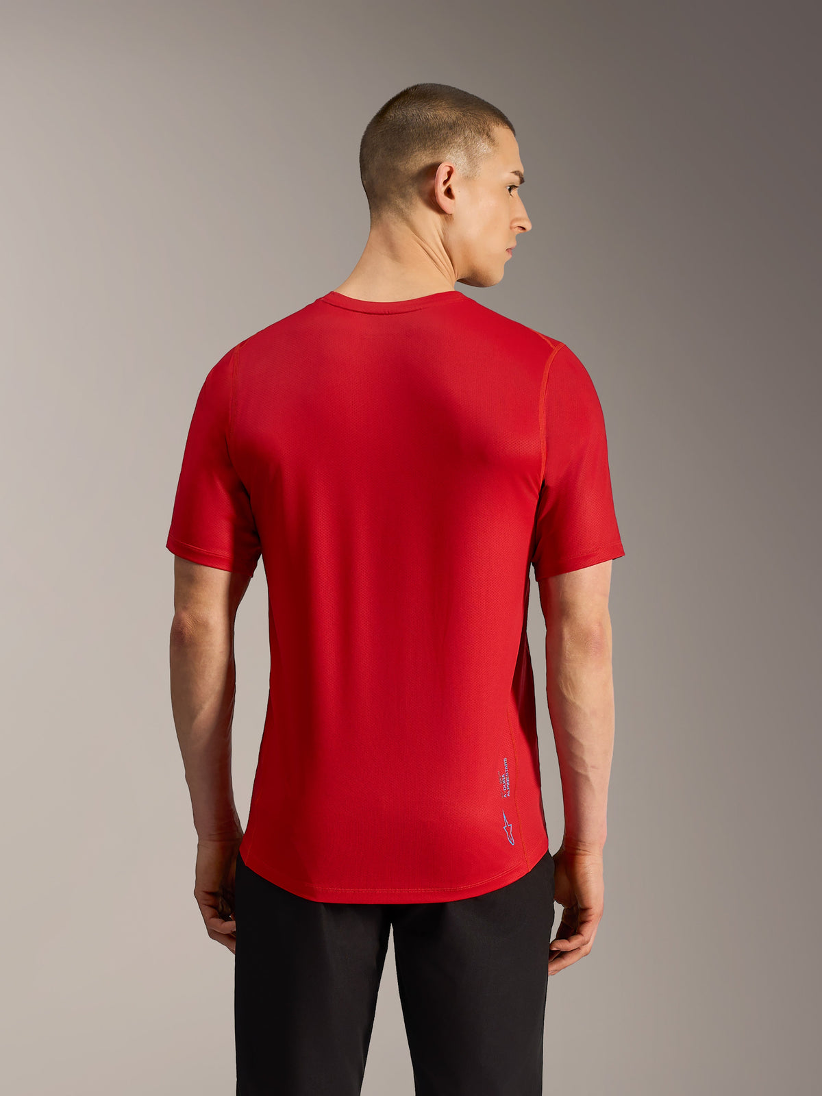 Rotes A-Dura Ride Kurzarm-MTB-Trikot, Rückansicht mit Jacquard-Gewebe, verlängertem Saum und dezentem Branding.