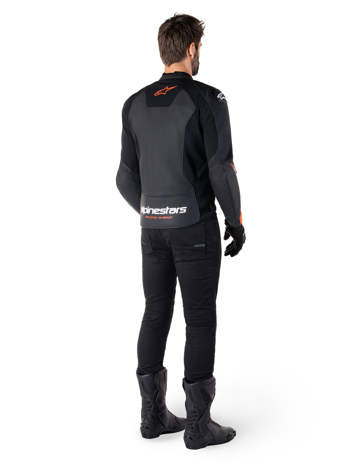 Alpinestars Faster V3 Leather Jacket, Sport Motorcycle Jacket, Black and Red Fluo, rear view worn with black pants and black boots, featuring 'alpinestars RACING AHEAD' text on the lower back and a small red star logo, sleek sport-fit leather construction