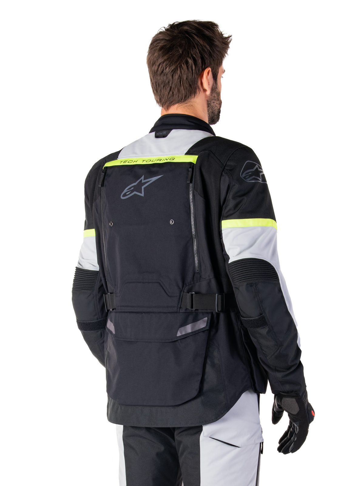 Alpinestars Bogota' Pro Drystar® Jacket, adventure touring jacket, Black Ice Gray and Yellow Fluo, rear view featuring large back pocket panel with 'TECH TOURING' branding, Alpinestars logo, and fluorescent accents, technical textile riding gear