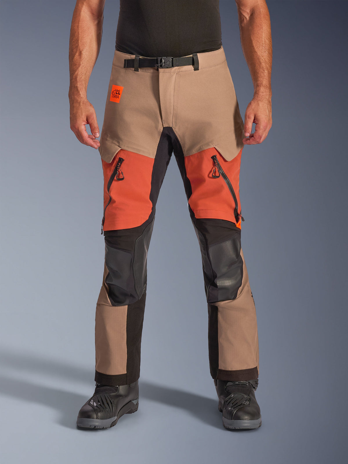 Alpinestars Halo Pro Drystar XF Laminated Pants, Adventure Motorcycle Touring Pants, Walnut, Rust, and Black, featuring waterproof laminated construction, front-facing view with orange thigh vents, black YKK AQUASEAL zippers, and adjustable waist belt.