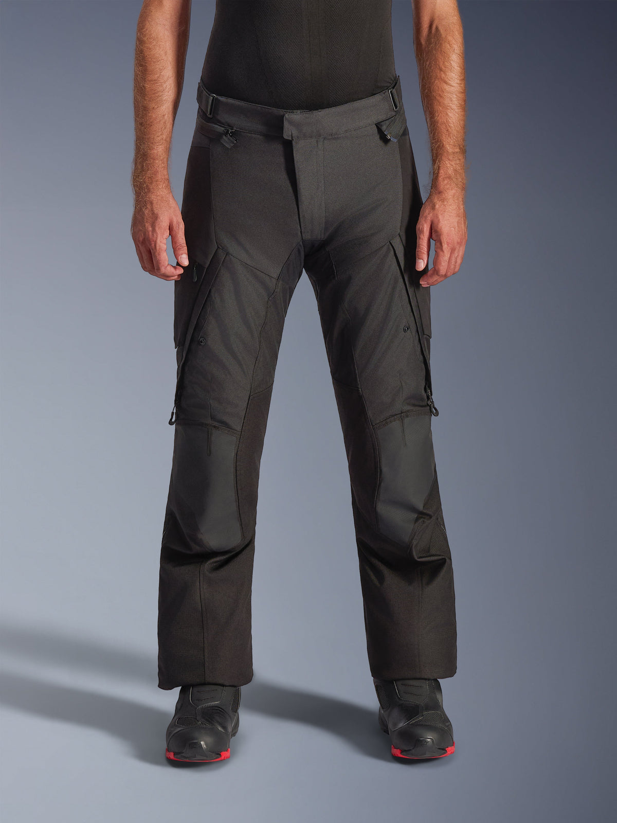 Alpinestars Andes V4 Drystar® Pants - Long, Motorcycle Adventure Touring Pants, Black, front view showing textile construction with cargo pockets, reinforced knees, and adjustable waist, worn with black motorcycle boots, designed for waterproof all-weather protection