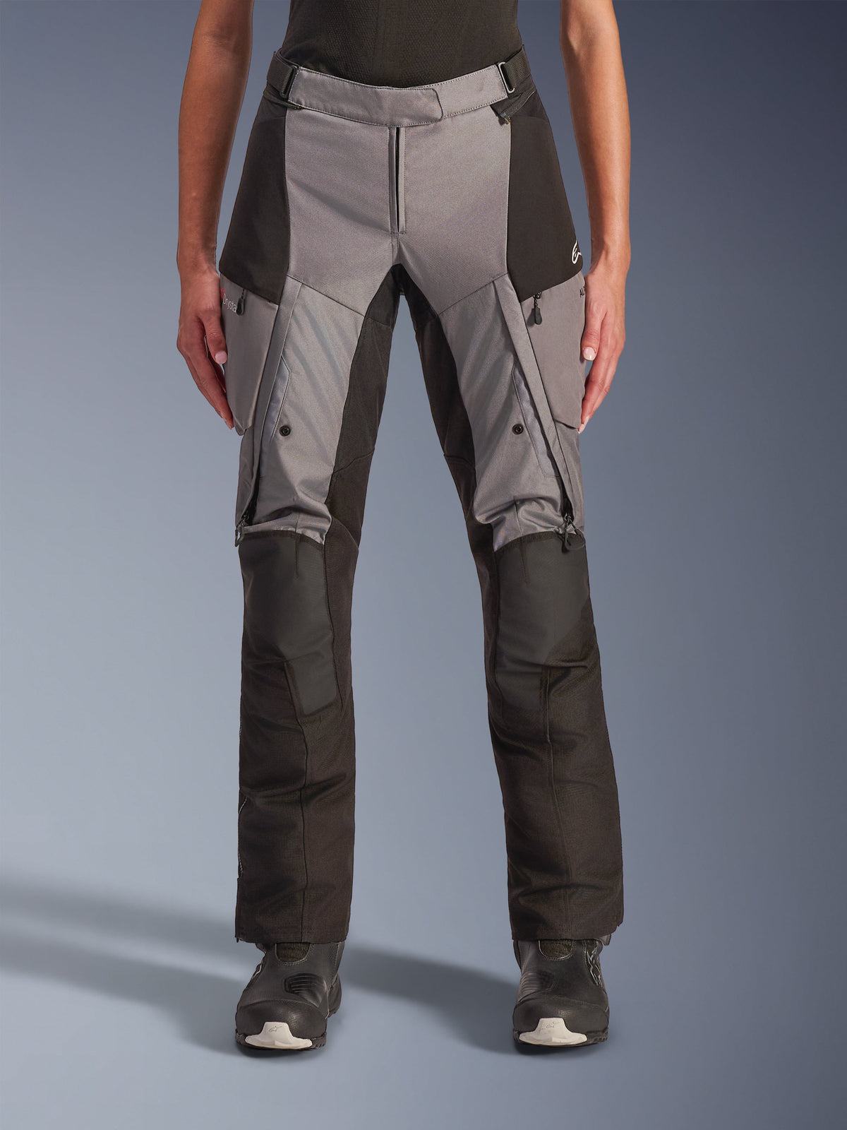 Alpinestars Stella Andes V4 Drystar Pants, Women's Motorcycle Touring Pants, Gray and Black, front view showing zippered thigh vents, cargo pockets, and reinforced knee sections, designed for all-weather adventure riding