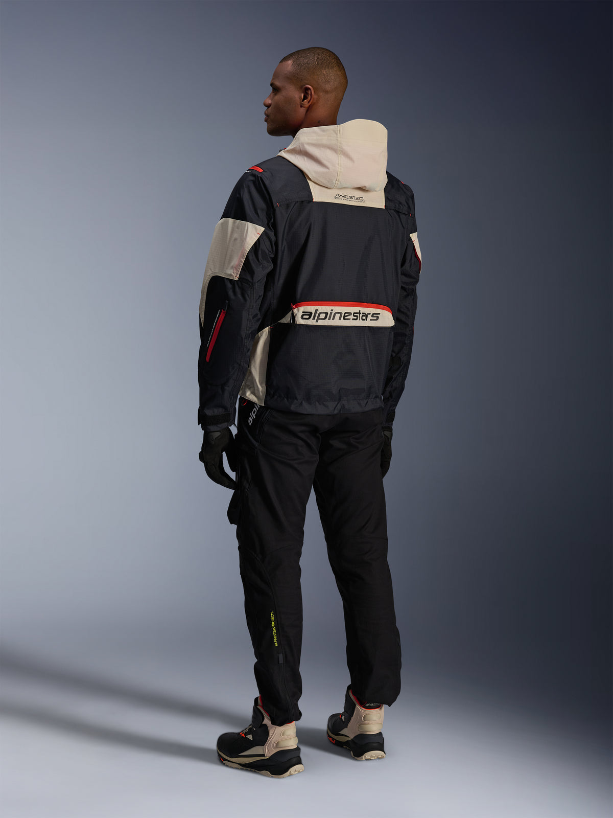 Alpinestars Mogress Air Jacket, Black and Almond urban motorcycle jacket with Hot Orange accents, back view.