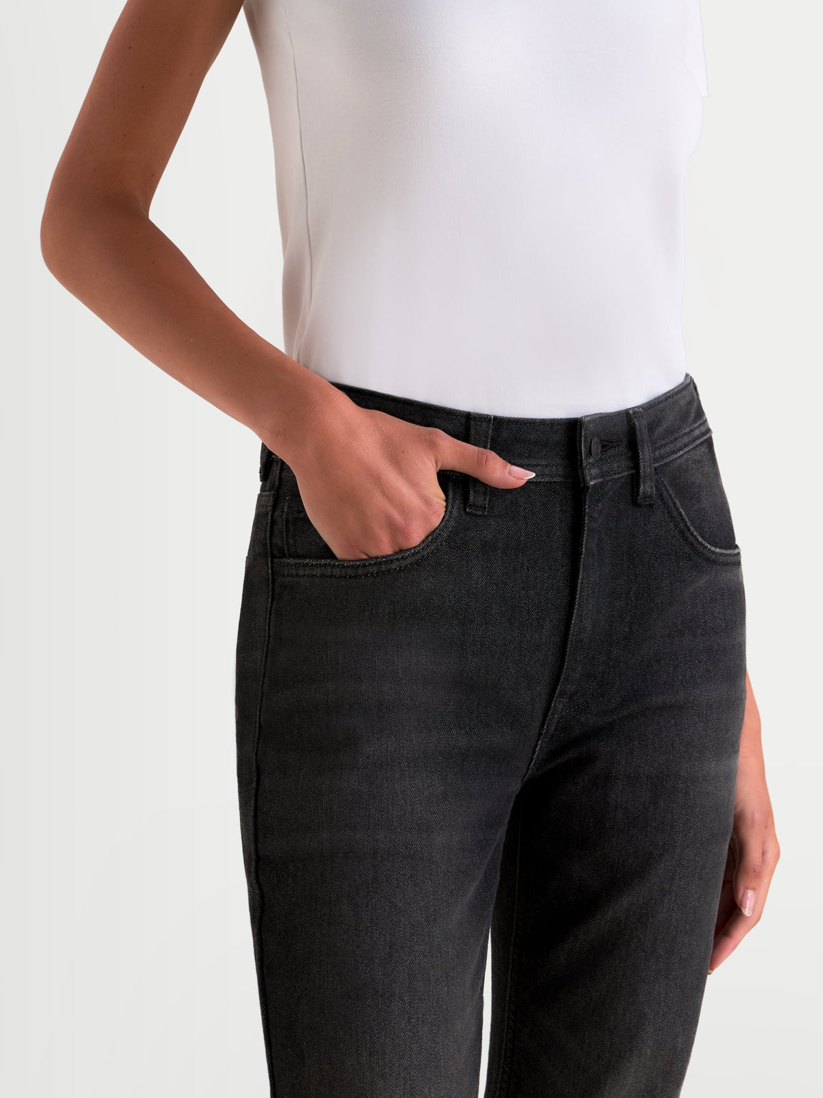 Alpinestars Stella Flex-AST 5 Denim Pants Short, women's urban motorcycle denim pants in black washed, close-up view showing the waistband and front pocket details worn by a model