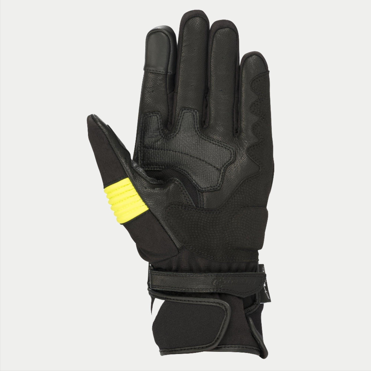 Alpinestars T-SP W Drystar® Handschuhe, Schwarz und Gelb Fluo, Handflächenansicht mit Ziegenlederkonstruktion, neongelbe Akzente am Daumen, touchscreen-kompatible Fingerspitzen, doppelter Klettverschluss am Handgelenk.