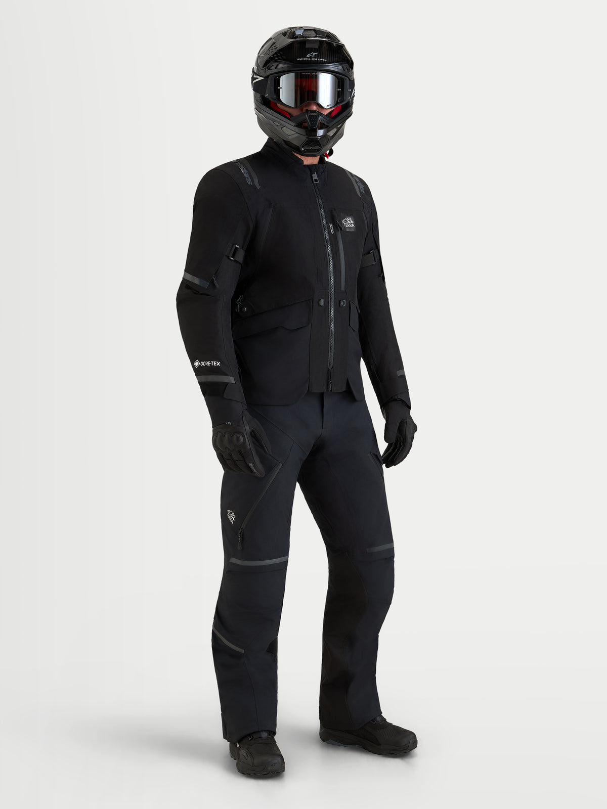 Alpinestars St-7 V2 2L Gore-Tex Jacket, Men's Black adventure motorcycle touring jacket with GORE-TEX waterproof construction worn with matching black riding gear and helmet