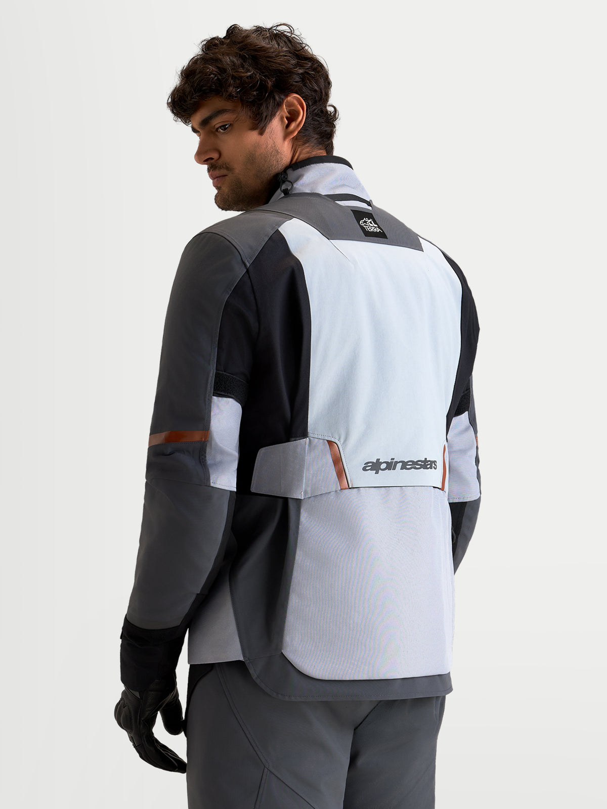 Alpinestars St-7 V2 2L Gore-Tex Jacket, men's adventure touring motorcycle jacket in mid gray, deep gray, and black, rear view showing waterproof GORE-TEX construction and Alpinestars branding
