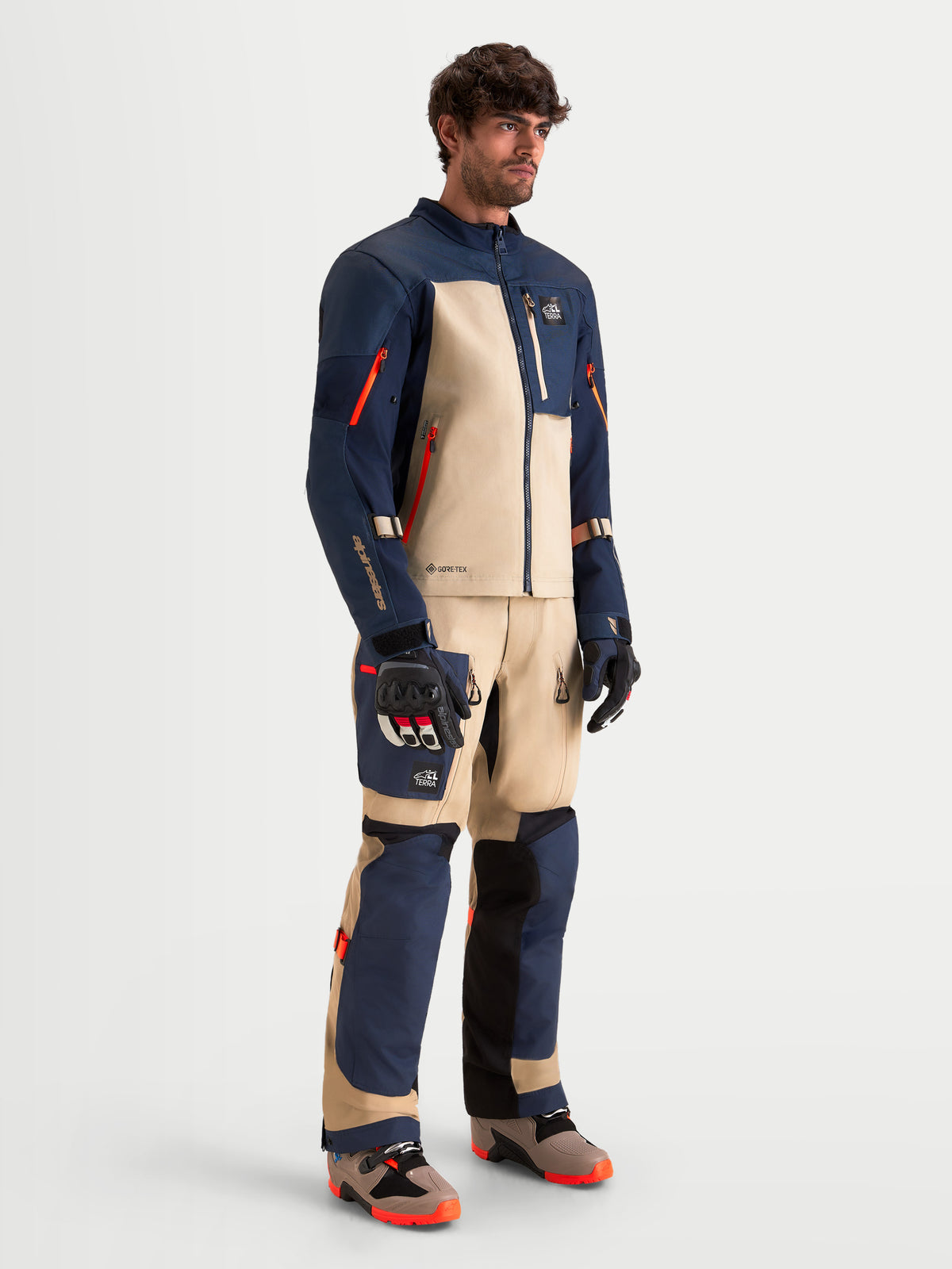 Alpinestars Arenis Gore-Tex Jacket, men's adventure touring motorcycle jacket in night navy and aluminum, featuring 2L GORE-TEX laminated construction and CE-certified protection worn by a model.