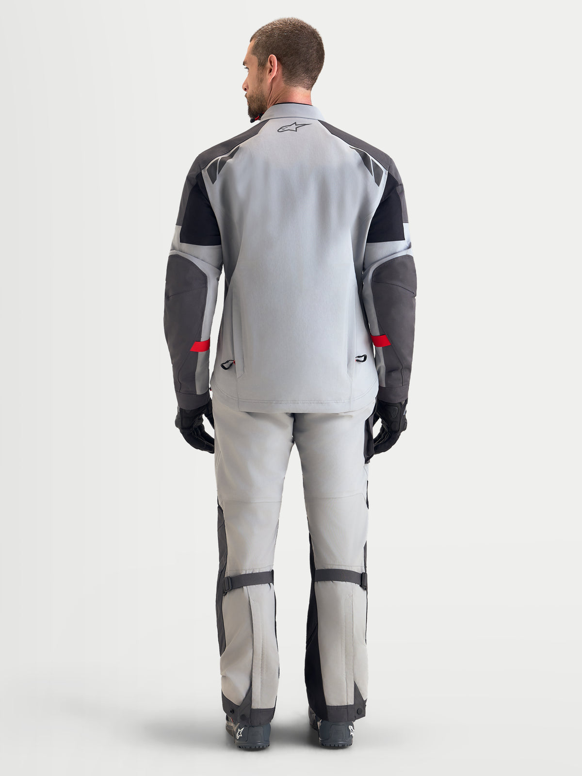 Alpinestars Arenis Gore-Tex Jacket, men's adventure touring motorcycle jacket in mid gray, deep gray, and black, rear view showing waterproof textile construction and integrated rear exhaust vents.