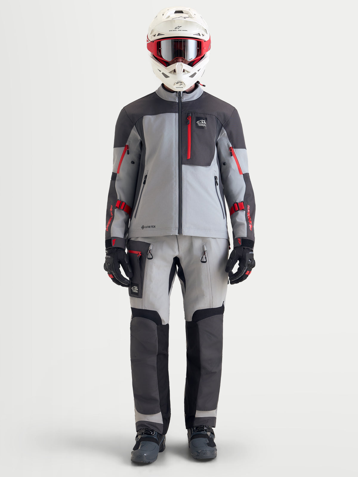 Alpinestars Arenis Gore-Tex Jacket, men's adventure touring motorcycle jacket in mid gray, deep gray, and black, shown on-model wearing full adventure riding gear with helmet and matching pants