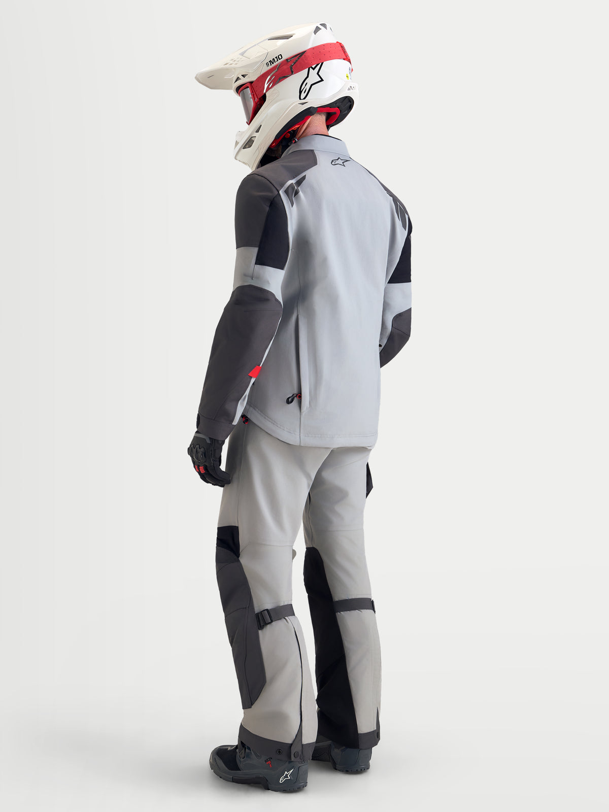 Alpinestars Arenis Gore-Tex Jacket, men's adventure touring motorcycle jacket in mid gray, deep gray, and black, rear three-quarter view showing waterproof textile construction and matching pants