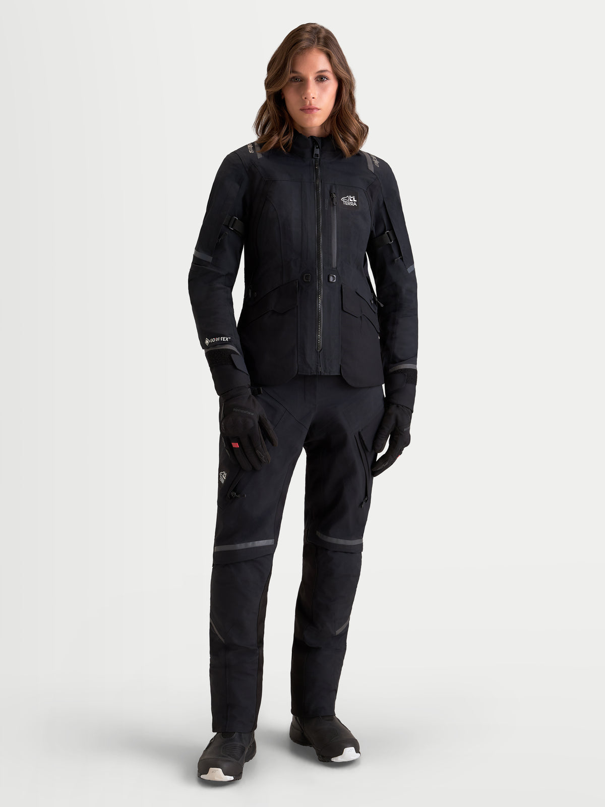 Alpinestars Stella St-7 V2 2L Gore-Tex® Jacket, women's adventure touring motorcycle jacket in black, front view on a model wearing matching gear, waterproof textile construction