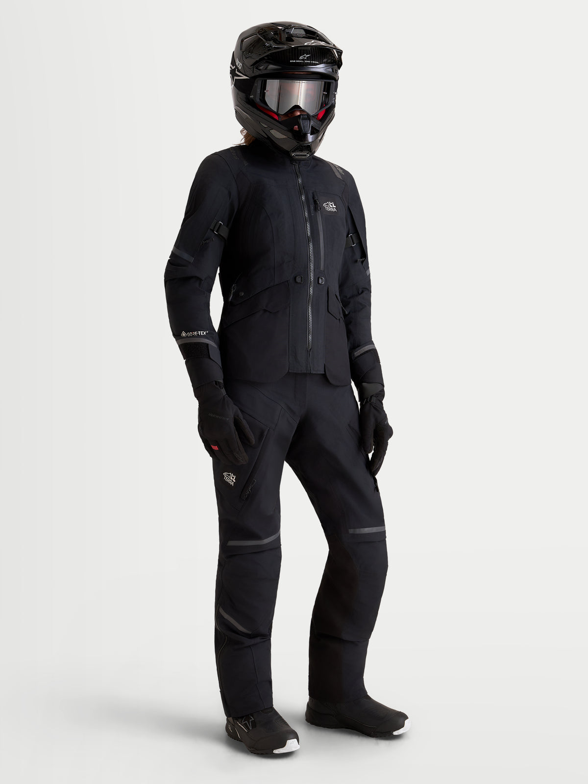 Alpinestars Stella St-7 V2 2L Gore-Tex Jacket AND Stella St-7 V2 2L Gore-Tex Pants, women's all-terrain adventure touring motorcycle gear set in black, front view worn by a model in full riding gear including helmet and gloves.