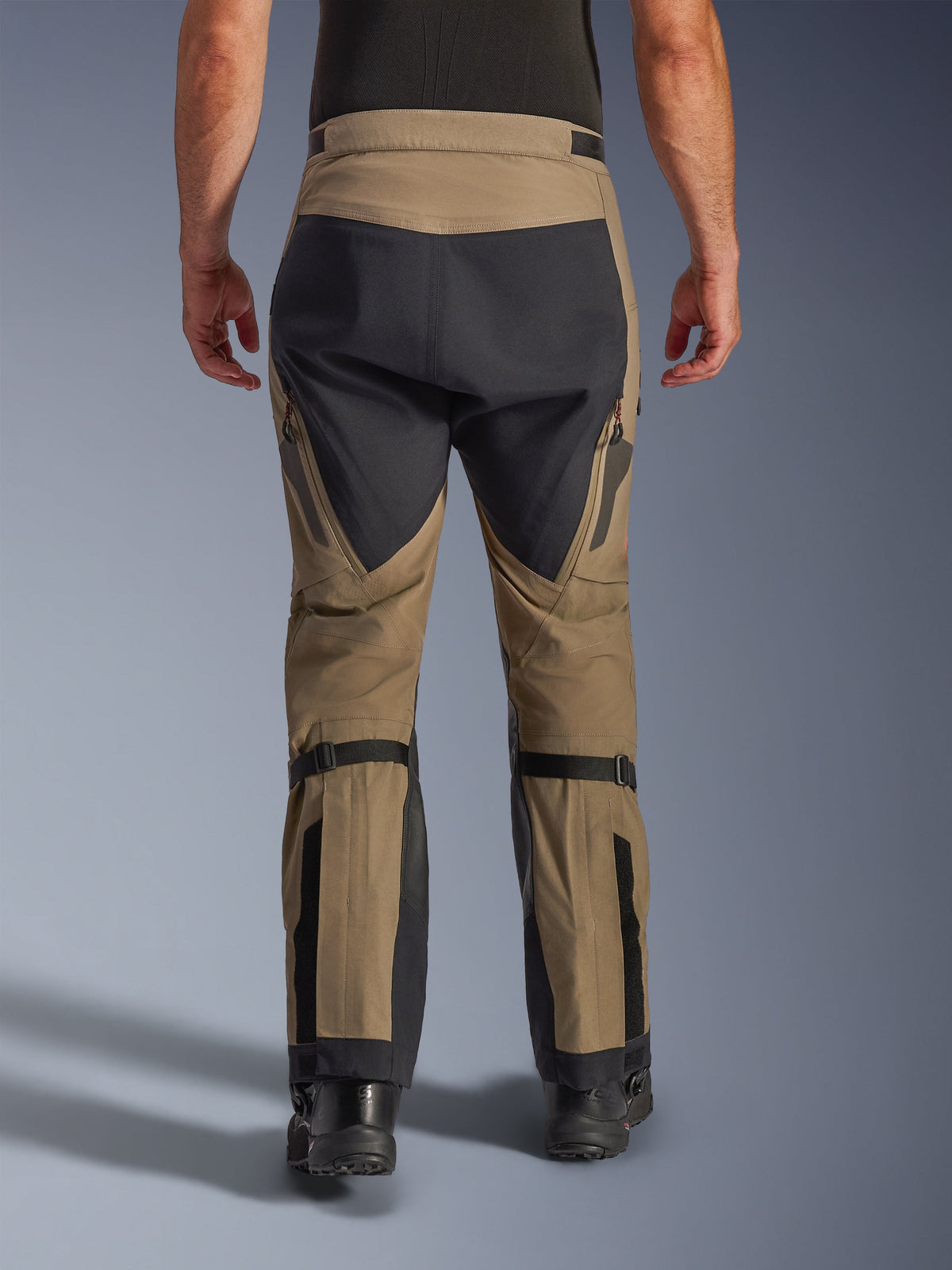 Alpinestars Nazca 3L GORE-TEX PRO Pants, Walnut and Black, rear view showing calf volume adjusters and reinforced panels, technical adventure motorcycle pants for all-weather riding