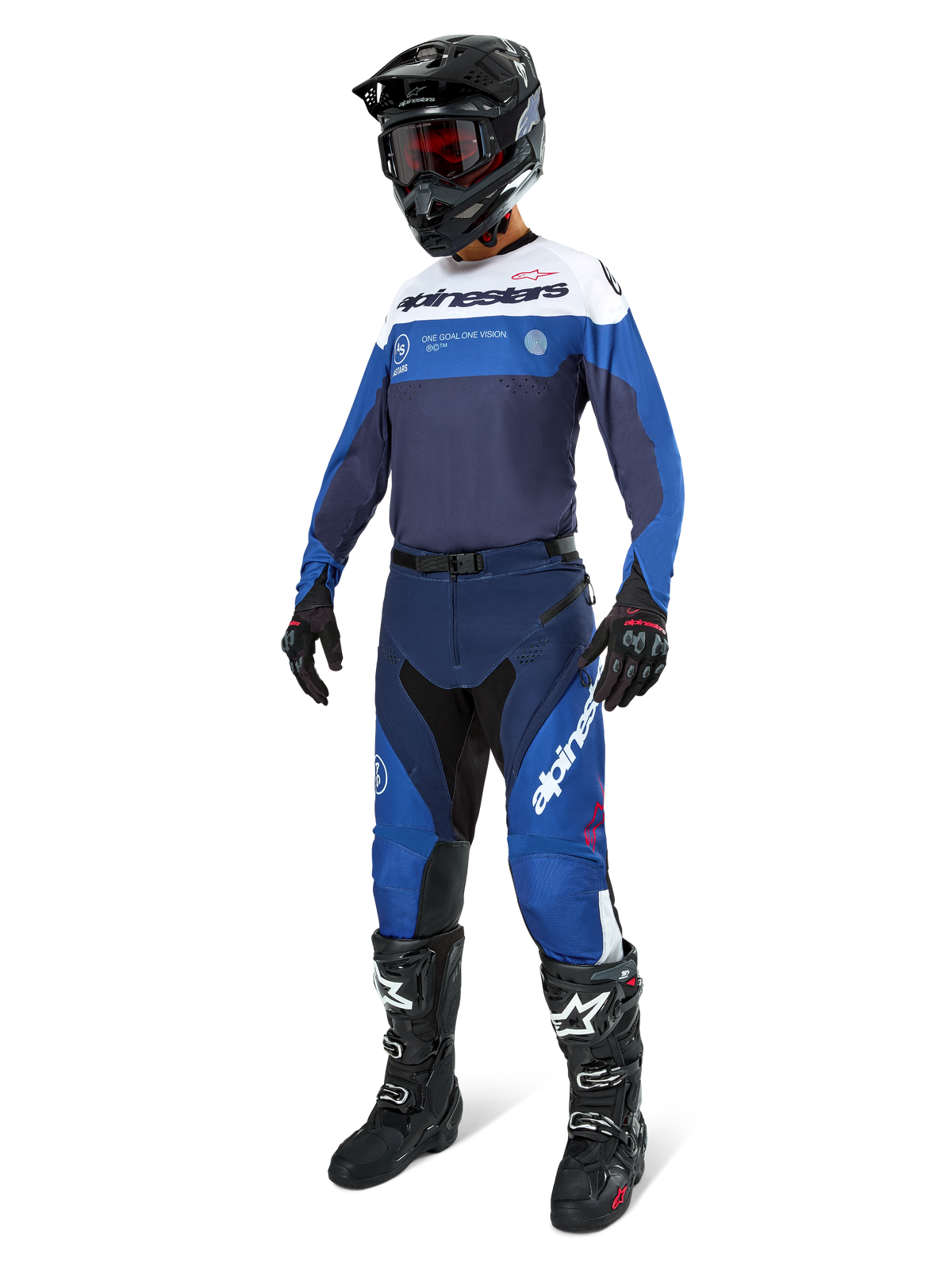 Motocross rider wearing Alpinestars Pro-Dura Pants in Navy, Bright Blue, and White, paired with a matching long-sleeve jersey, black helmet with red goggles, black gloves, and black and white boots, coordinated outfit for enduro and off-road racing.