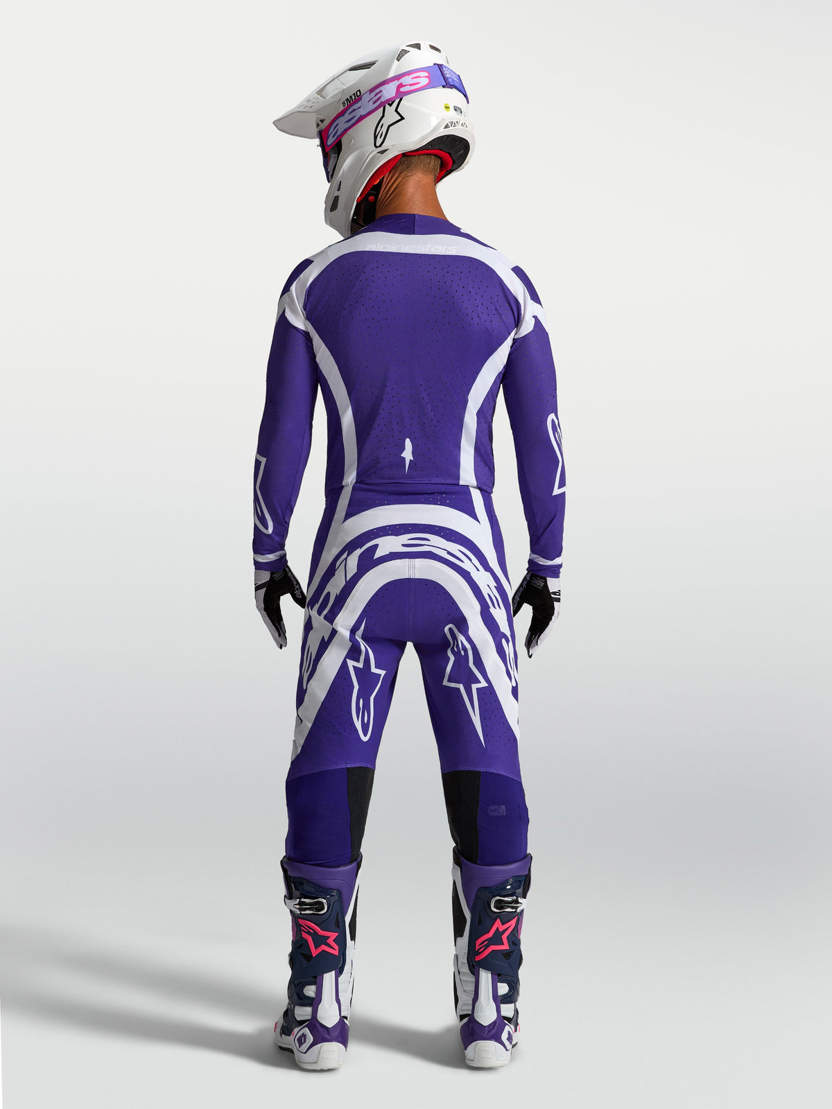 Alpinestars Supertech Vesta Pants and Jersey, Deep Blue and White motocross racing gear set shown from a rear view on model.