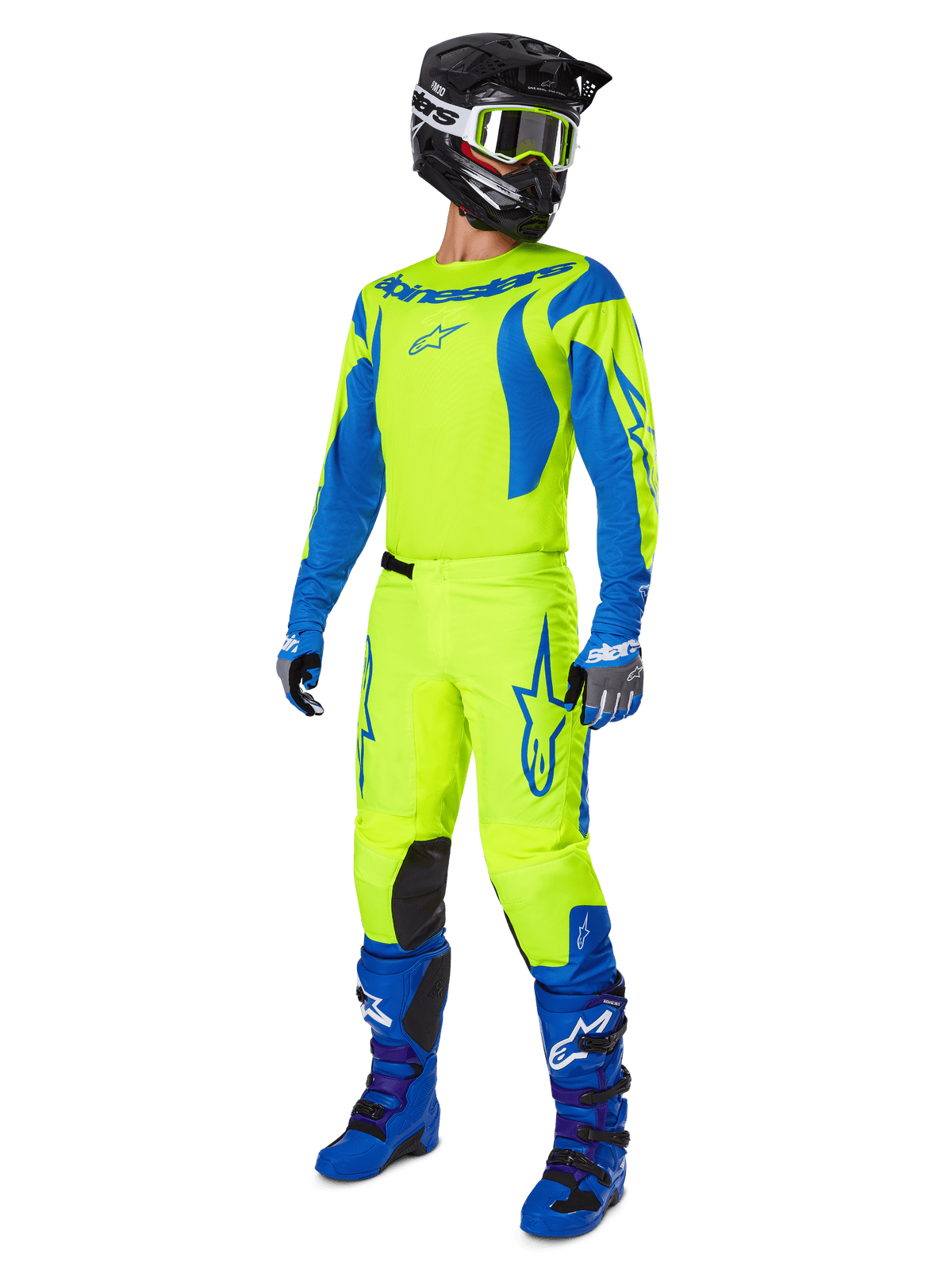 Alpinestars 2025 Fluid Haul Hose, Motocross-Hose, Leuchtendes Neongelb und Blau, getragen als Teil einer kompletten Rennausrüstung mit passendem Jersey, blauen Stiefeln und einem schwarzen Helm, High-Visibility-Design für das Offroad-Fahren.