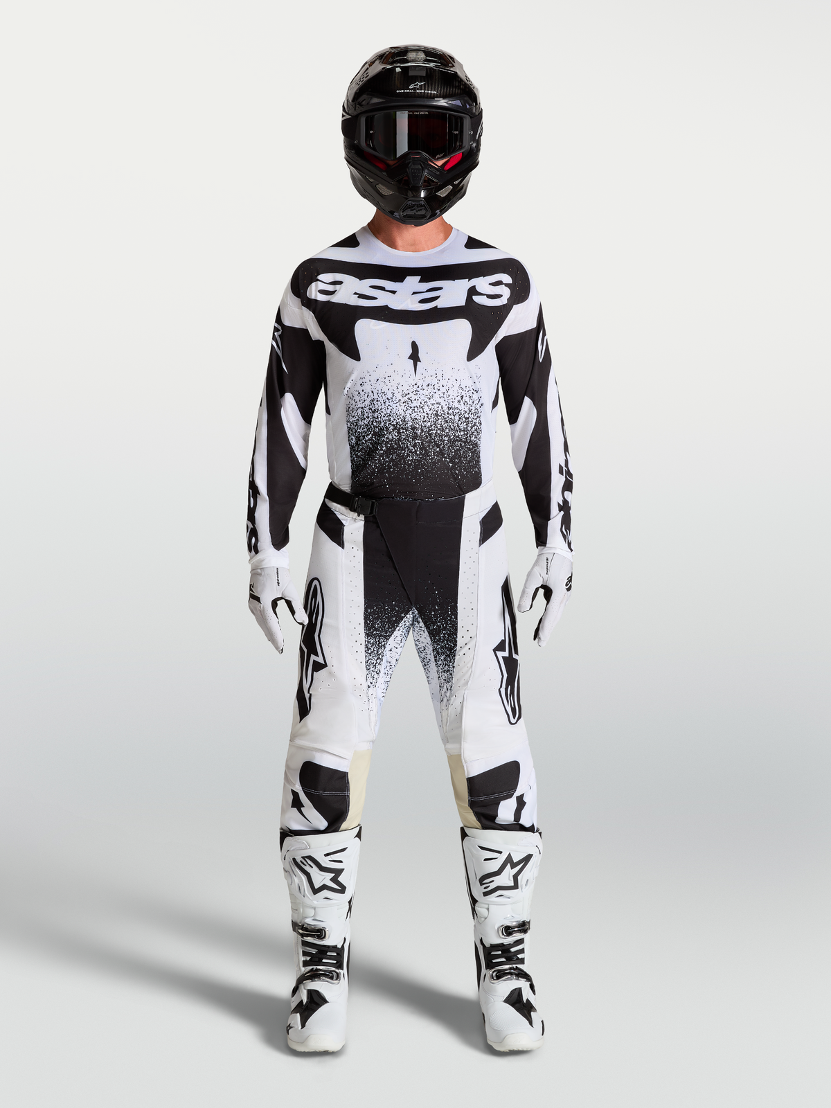 Alpinestars Techstar Swan Pants and jersey, white and black motocross gear set with matching boots on a model.