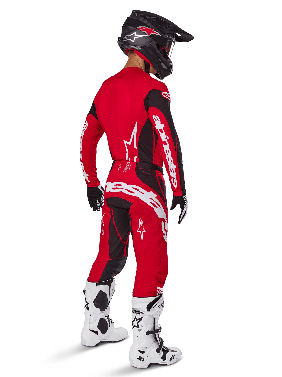 Alpinestars 2025 Techstar Dreem Pants, Motocross Pants, Bright Red and Black, worn by a rider from a rear perspective in a full racing kit with matching red jersey, black helmet, and white boots, featuring bold white Alpinestars branding and black stretch panels.