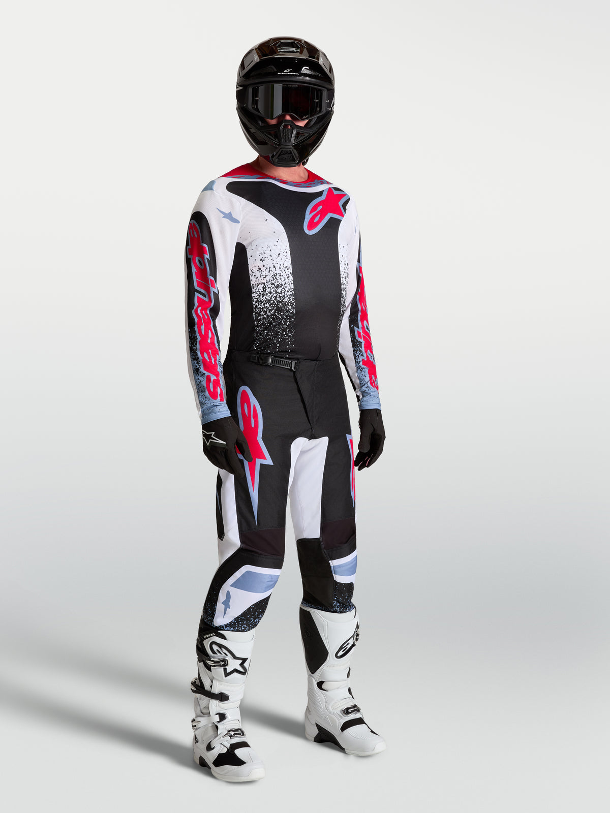 Alpinestars Fluid Drag Hose, Motocross-Rennausrüstung für Herren, Schwarz und Weiß mit fluoreszierenden roten Akzenten.