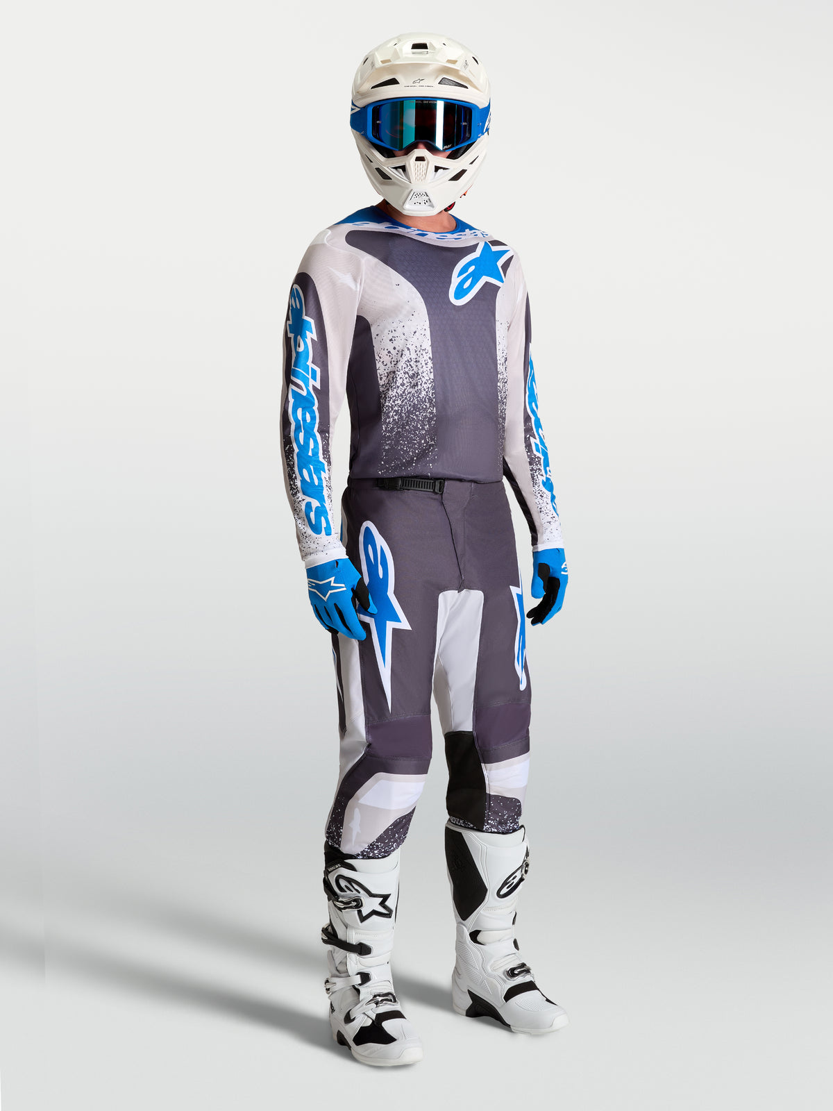 Alpinestars Fluid Drag Motocross-Hose und Trikot in Grau und Blau, ergonomisches 3D-Design für Performance.