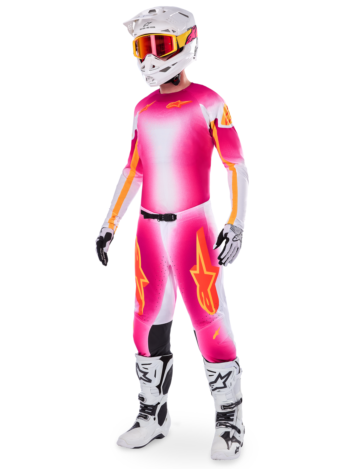 Motocross-Fahrer im Alpinestars Supertech AFD MIG Limited Edition Gear-Set, Trikot und Hose mit Farbverlauf in Pink Fluo, Weiß und Orange, weißer Helm mit orangefarbener Brille, weiß-schwarze Stiefel, professionelle Motocross-Bekleidung