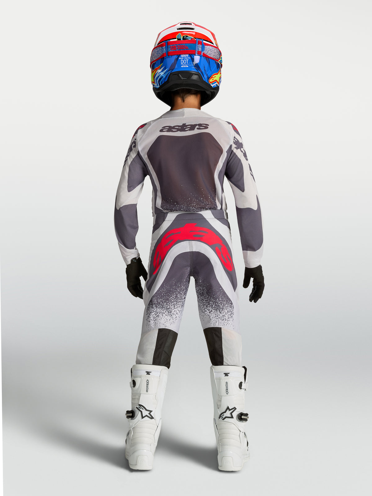 Alpinestars Jugend Supertech Swan Hose, Motocross-Rennbekleidung in Grau und Fluo-Rot, Rückansicht.