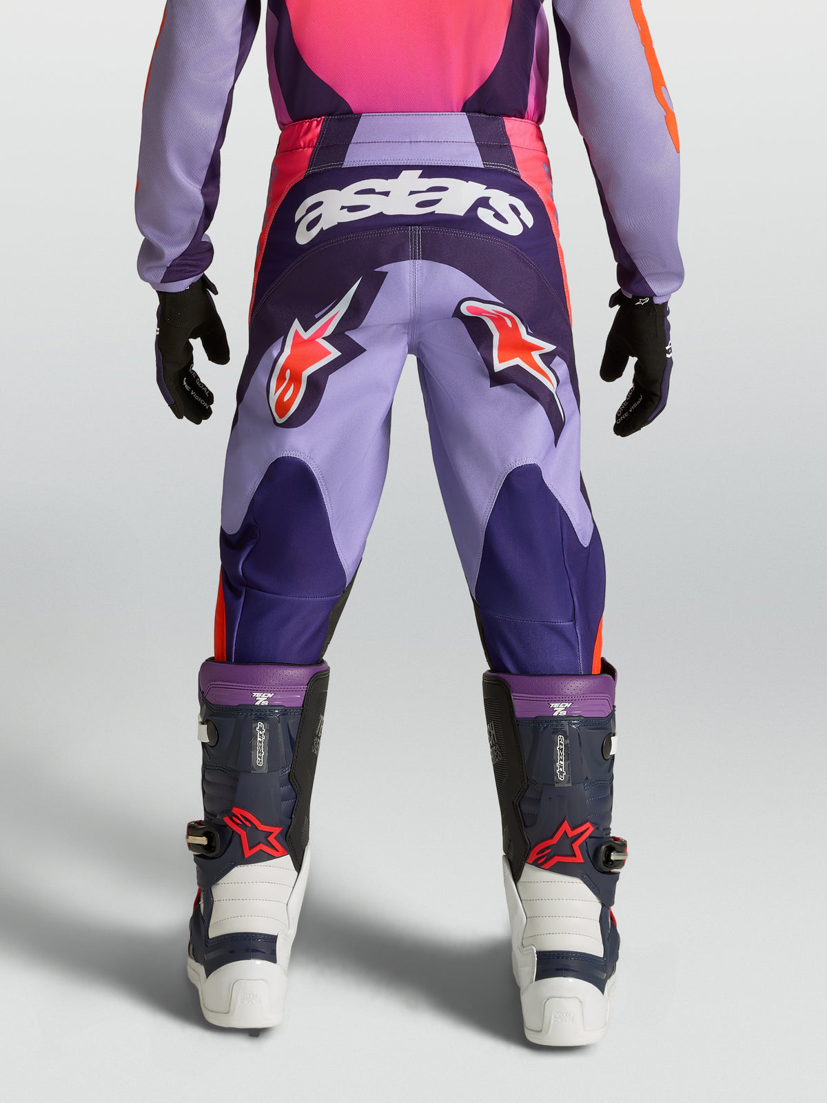 Alpinestars Fluid Hunt Jugend-Hose, lila-pinke Motocross-Hose mit Stern-Logos und strapazierfähiger Textilkonstruktion.