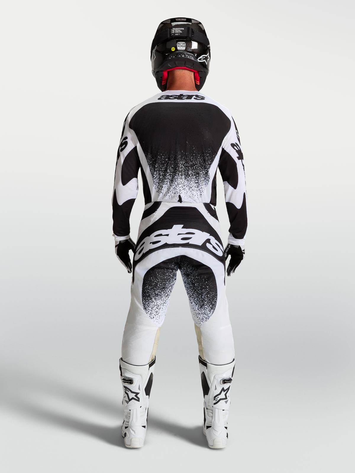 Alpinestars Techstar Swan Jersey and Gear Set, Men's Motocross Outfit in White and Black featuring rear splatter graphics.