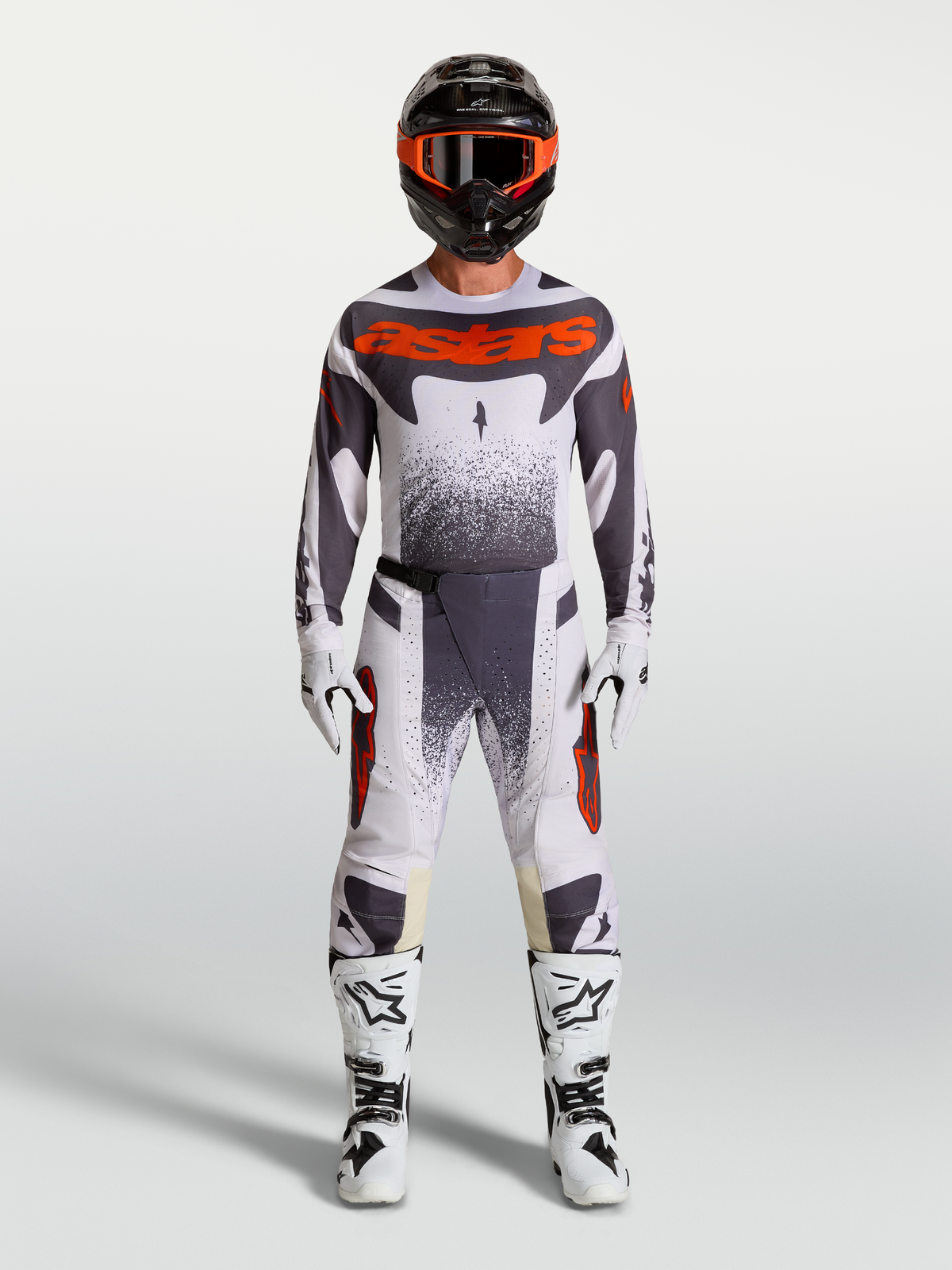Alpinestars Techstar Swan Gear Set, gray and red fluo motocross racing jersey and pants for performance riding.
