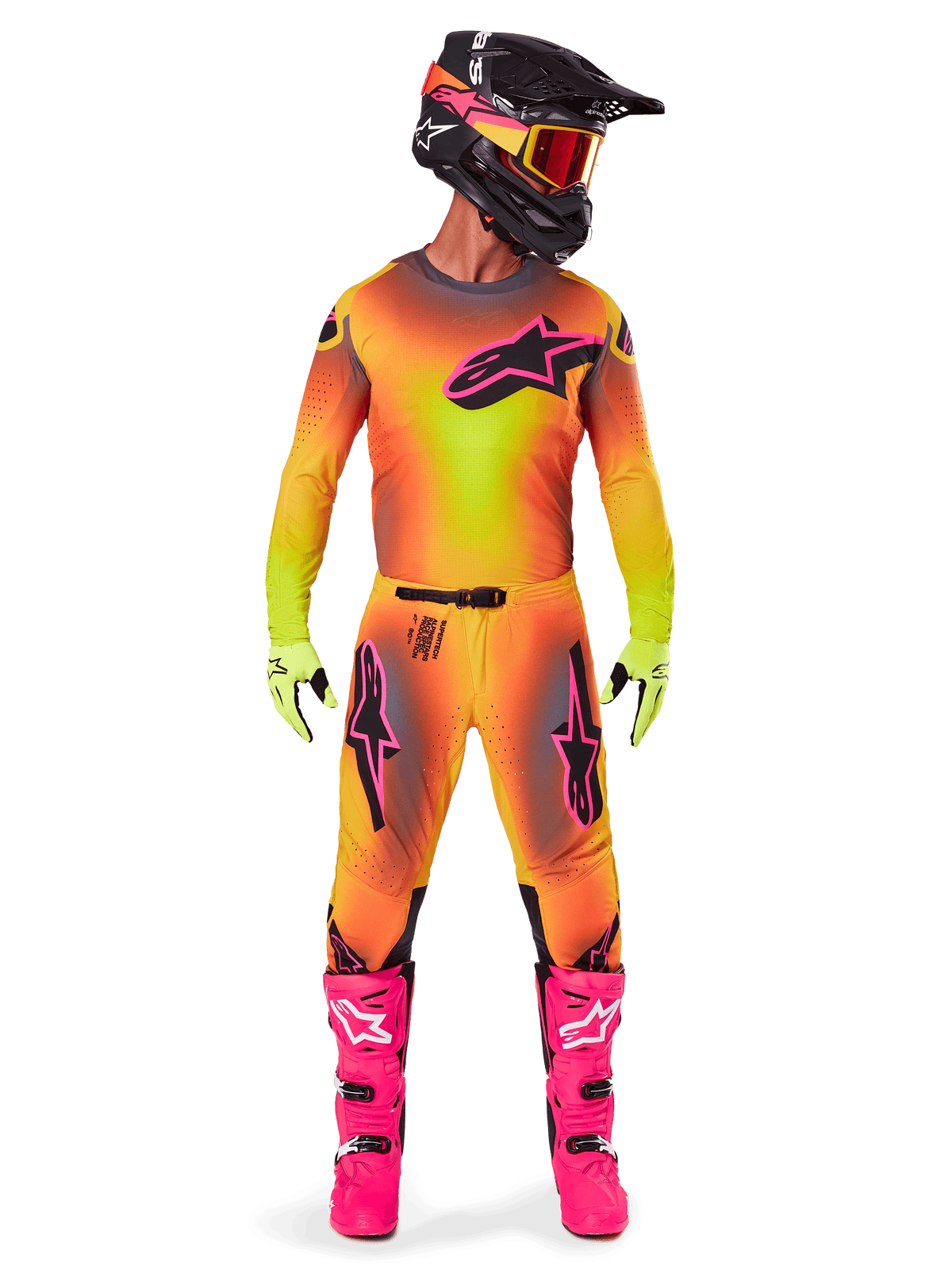 Motocross rider wearing complete racing gear, 2025 Supertech Lipan Jersey and Pants in a yellow and orange gradient with pink accents, black helmet with matching pink graphics, bright pink boots, and lime green gloves, coordinated Alpinestars off-road racing outfit.