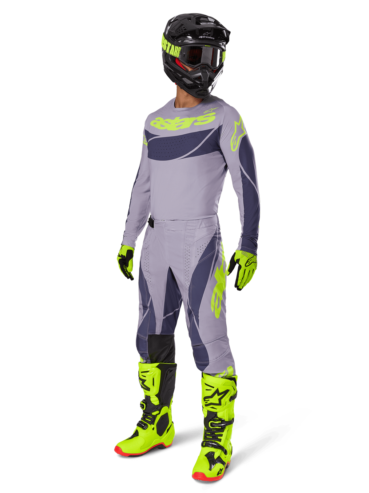 Motocross-Fahrer im 2025 Techstar Dreem Trikot in Grau und Dunkelgrau mit neongelben Akzenten, komplette Rennausrüstung mit passender grauer Hose, neongelben Stiefeln und Handschuhen sowie schwarzem Helm, abgestimmtes Offroad-Performance-Outfit