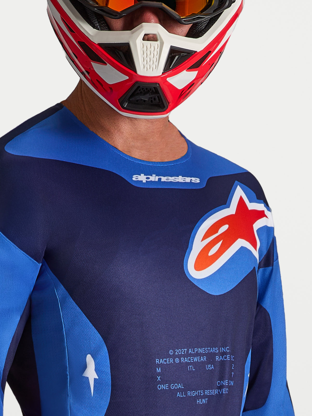 Alpinestars Racer Hunt Jersey, Men's Motocross Racing Jersey, Blue and Red, featuring moisture-wicking polyfabric, ergonomic sport fit, and large chest logo.
