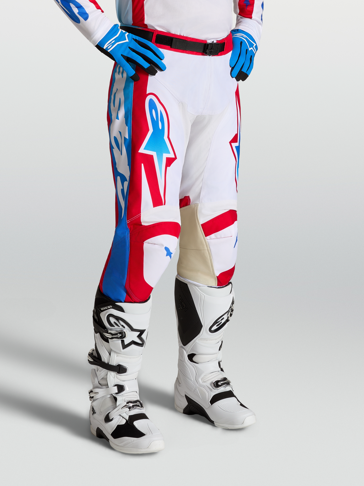Alpinestars Racer Hunt Pants, motocross racing pants in White, Red, and Blue with pre-curved legs and leather inner knees.