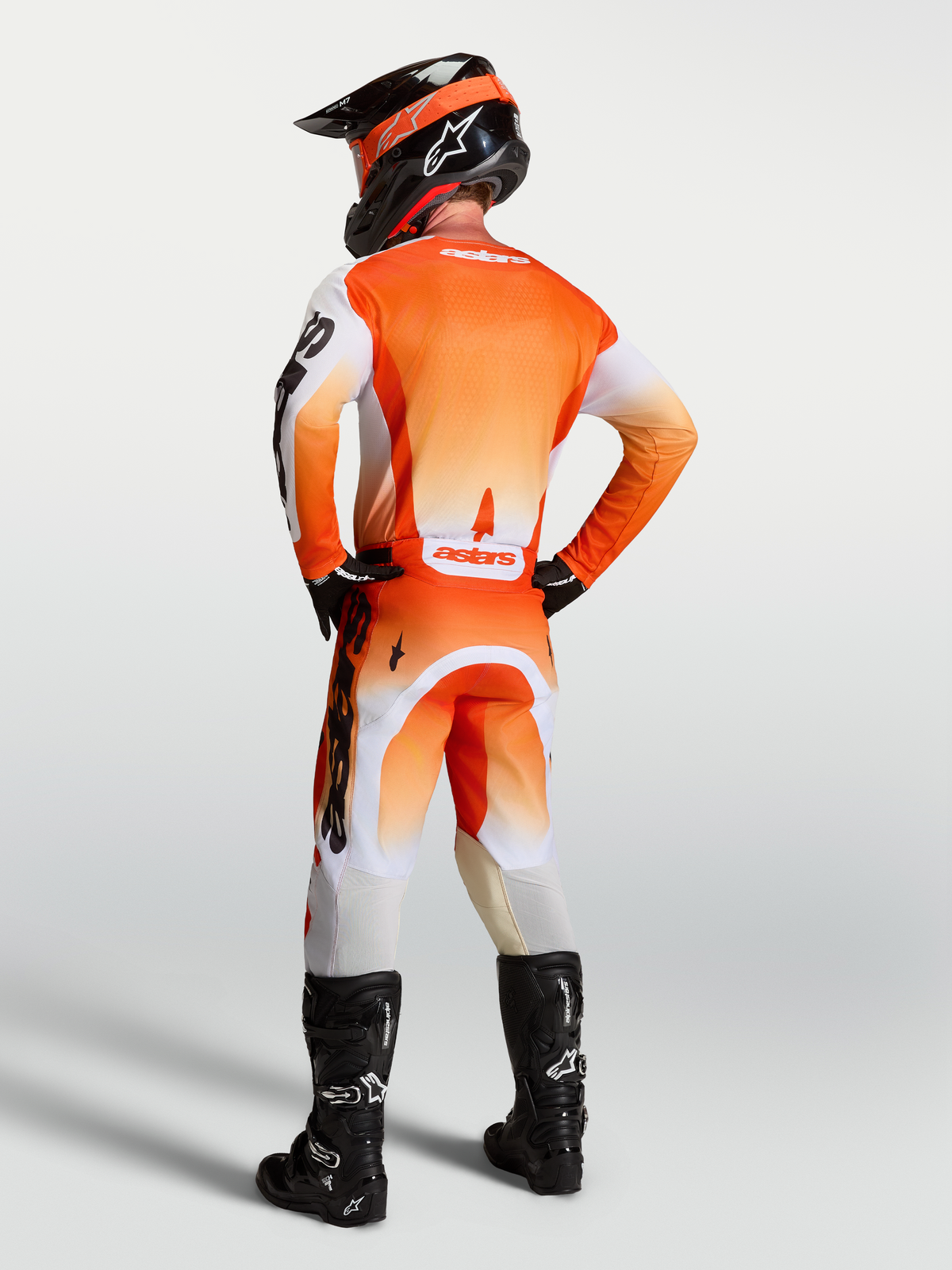 Alpinestars Racer Amber Jersey, orange and white motocross gear, back view showing moisture-wicking polyfabric and race fit.