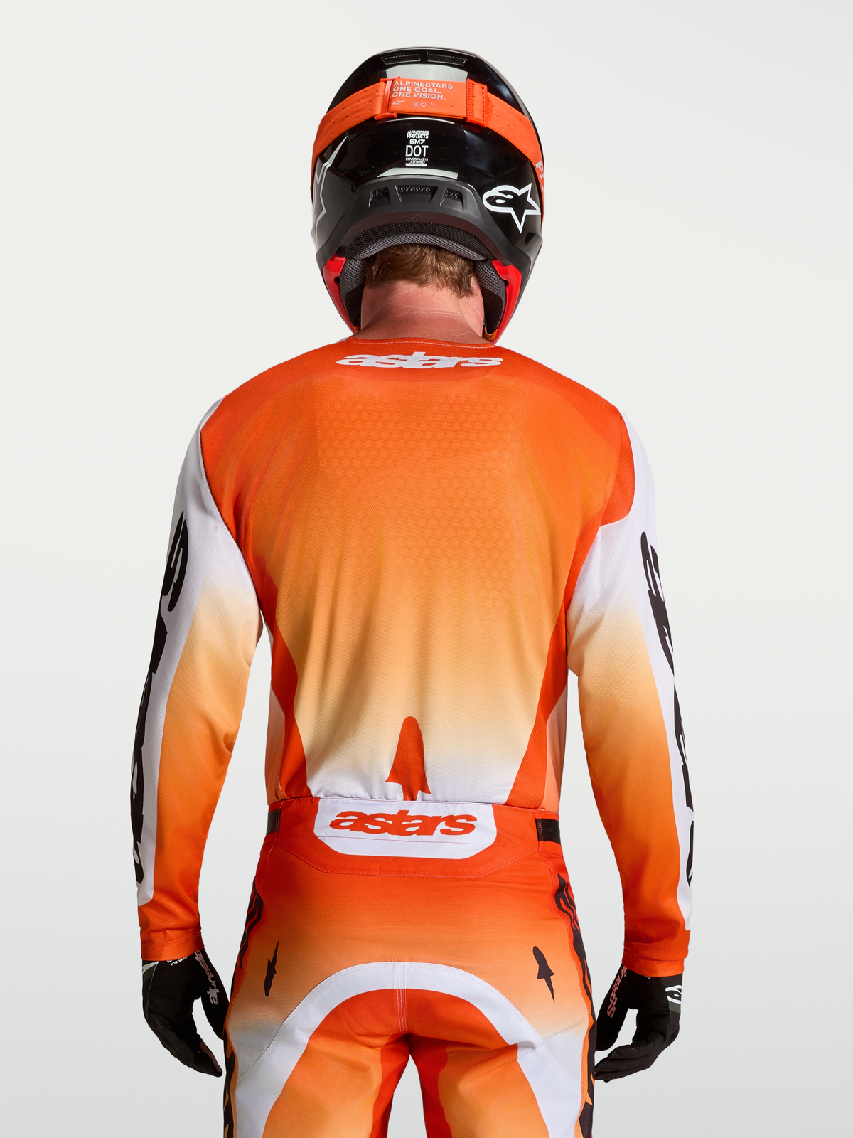 Alpinestars Racer Amber Jersey in orange and white, a breathable, moisture-wicking motocross racing jersey for men.