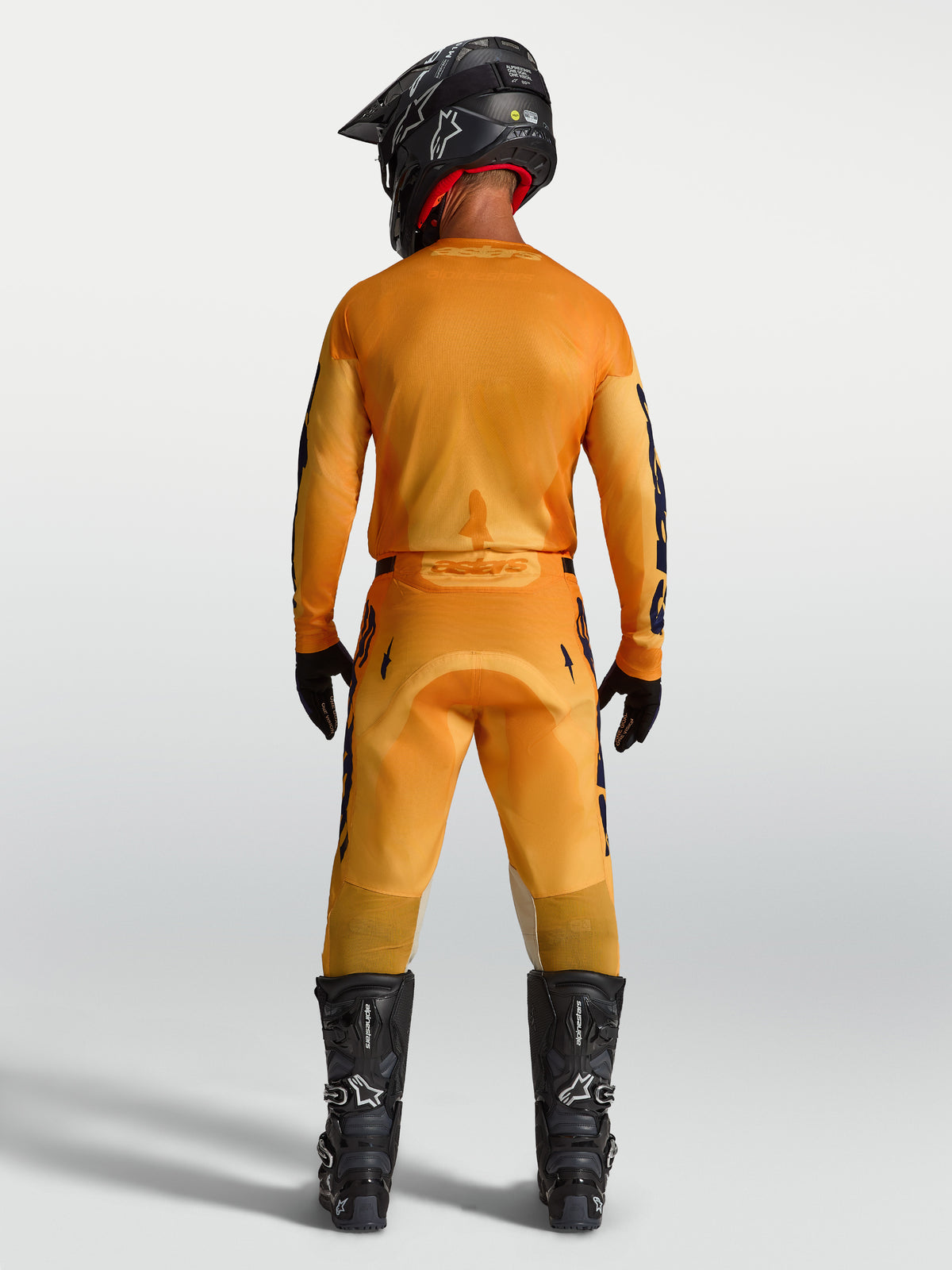 Alpinestars 2027 Racer Amber Trikot und Ausrüstungsset, Herren-Motocross-Outfit, Orange und Dunkelblau, Rückansicht.