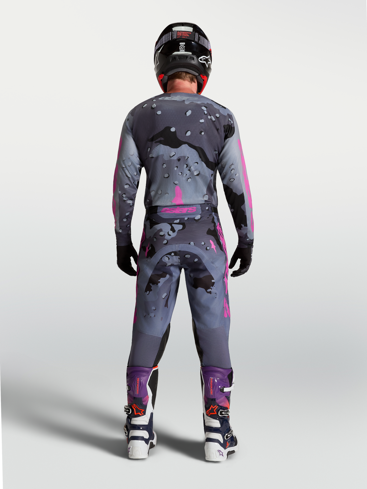 Alpinestars Racer Lone Gear Set, Gray and Purple camo motocross outfit, back view of rider in matching gear.