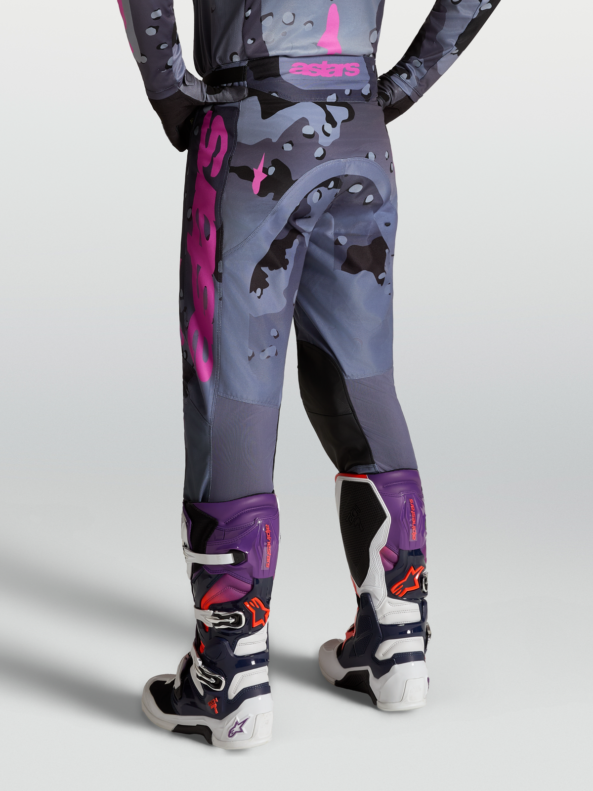 Alpinestars Racer Lone Pants, motocross riding pants in gray camo and purple, on-model rear view with Tech 7 boots.
