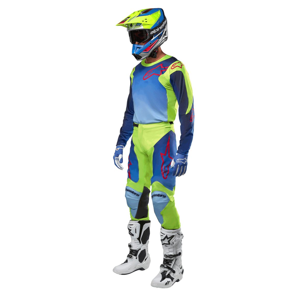 Alpinestars 2024 Racer Hoen Trikot, Motocross-Trikot, Gelb Fluo und Blau Night Navy, getragen von einem Fahrer mit passender Hose, Helm und weißen Stiefeln, professionelle Rennausrüstung für Offroad-Fahrten