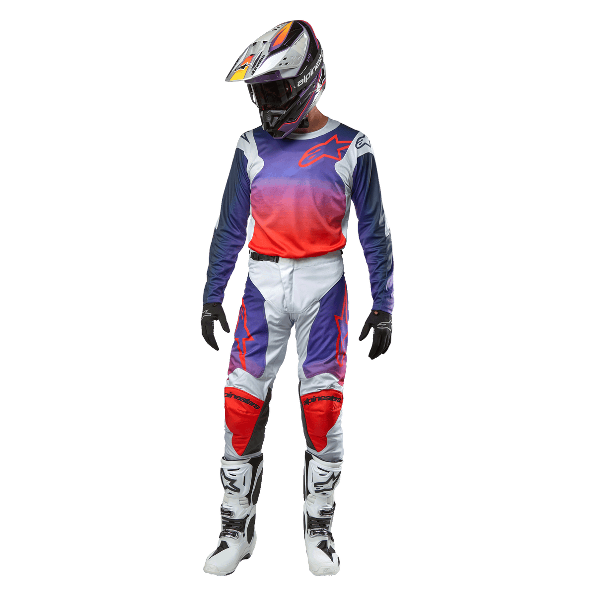 Motocross rider wearing complete racing gear, Alpinestars 2024 Racer Hoen Jersey with purple to hot orange gradient and light gray shoulders, matching light gray pants with red and purple accents, coordinated helmet and white boots, full off-road racing outfit